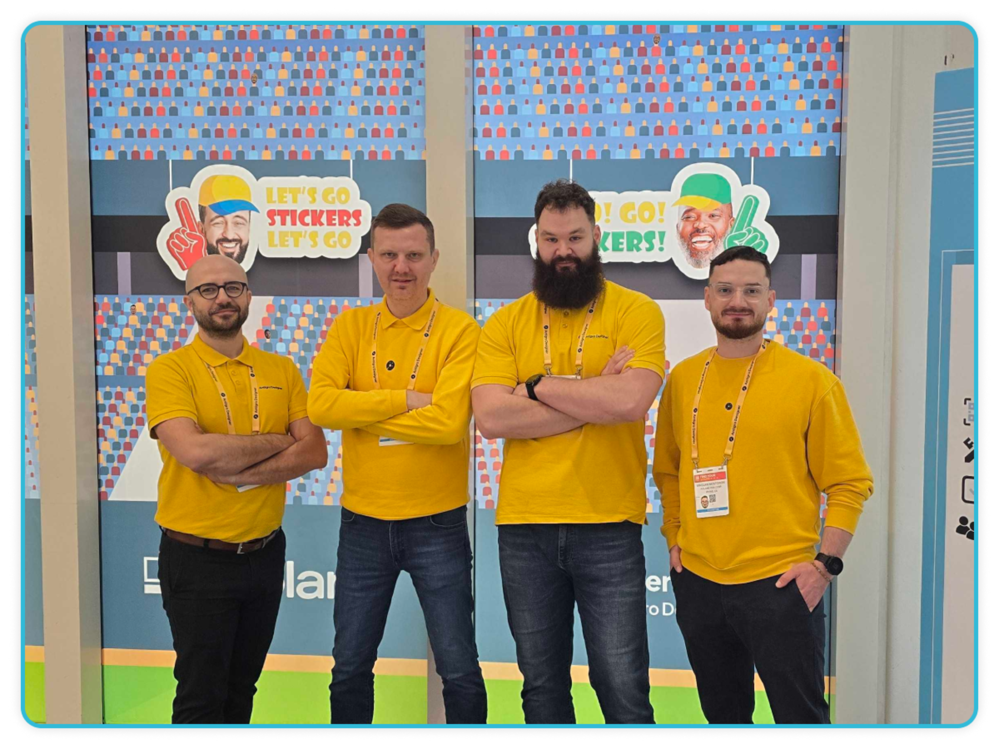 Four Sticker Builder team members in yellow shirts at "Let's Go Stickers" booth at ISA Sign Expo 2026